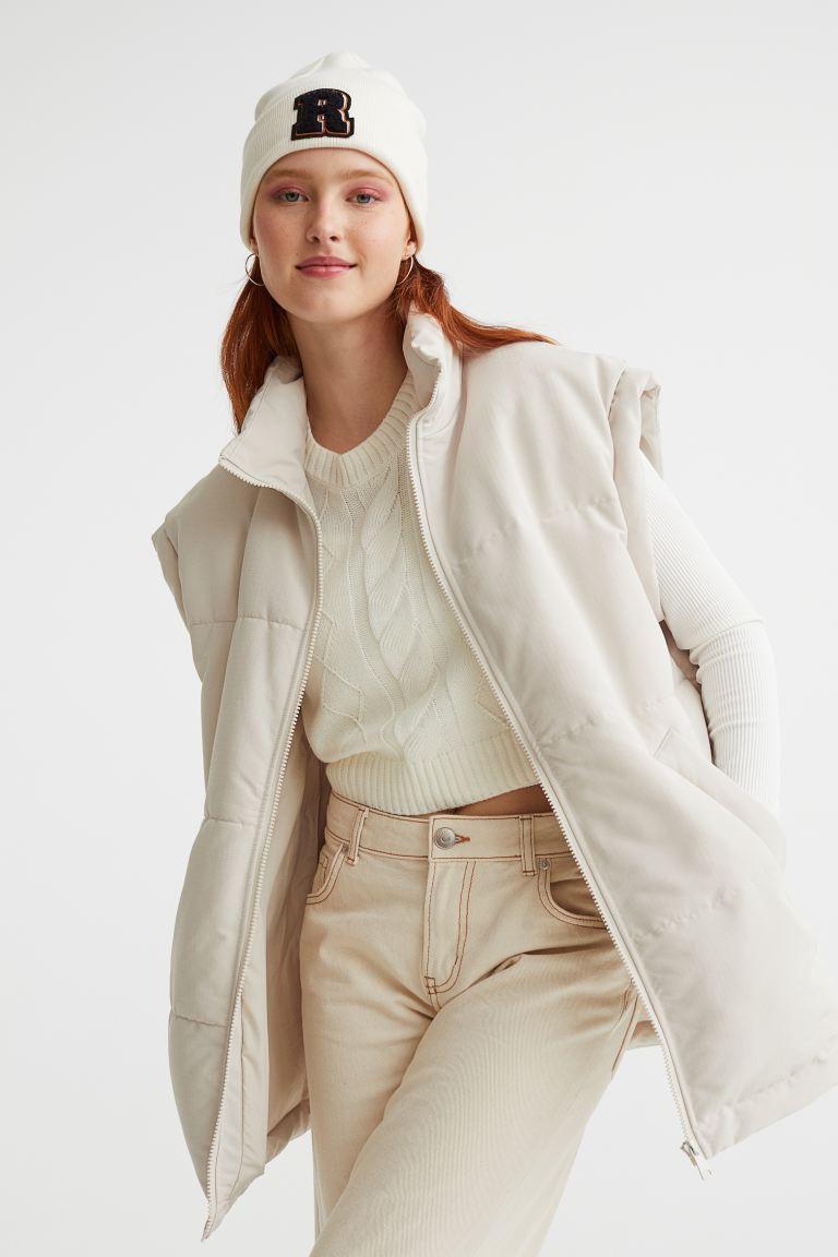 Relaxed-fit, padded vest in quilted, woven fabric. High, stand-up collar, zipper at front, front pockets with flap, and gently dropped shoulders. Elasticized drawstrPuffer Vest