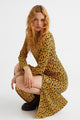 Calf-length dress in crinkled jersey with a printed pattern. Round neckline, opening at back of neck with button, and long sleeves. Straight-cut hem with high slit aCrinkled Jersey Dress
